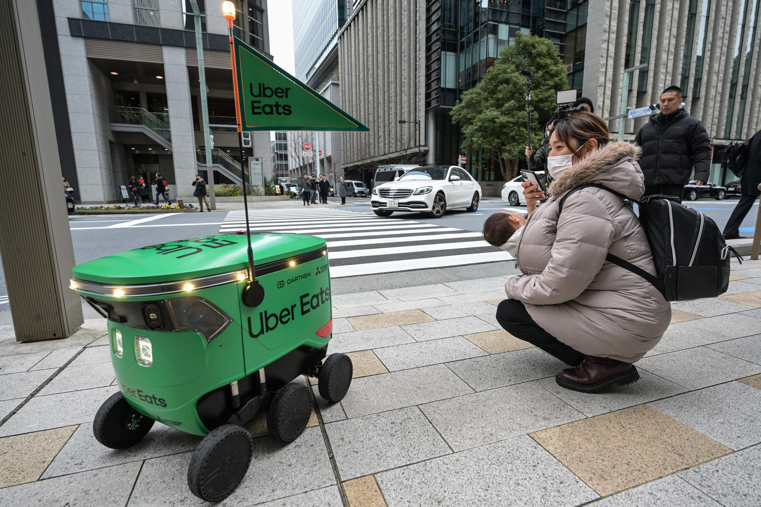 Tokyo Streets Buzz with Uber Eats Robots: A Future of Food Delivery Comes Alive